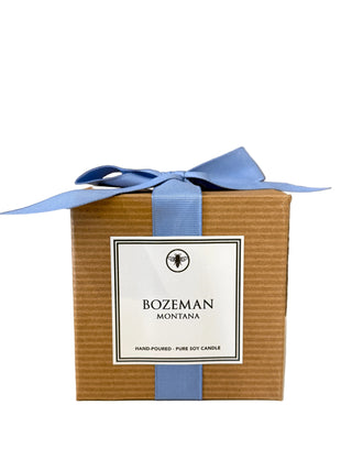 Ella B. Candles Bozeman, MT Custom Candle from 2101 CANDLES featuring a lit, decorative candle with a rustic design.